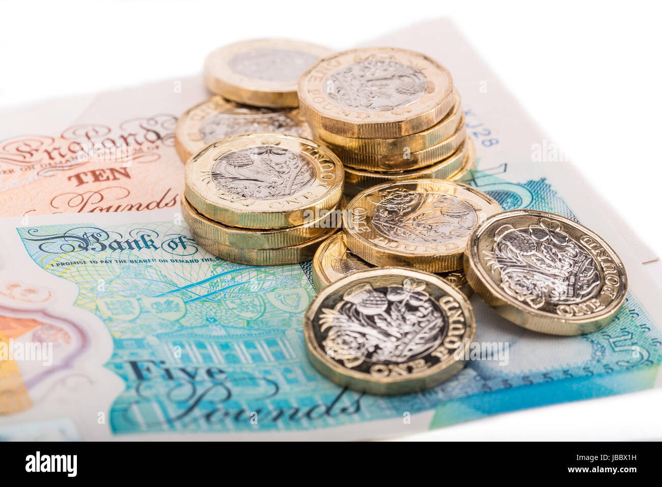 Une livre britannique de pièces sur les billets de banque britannique Banque D'Images