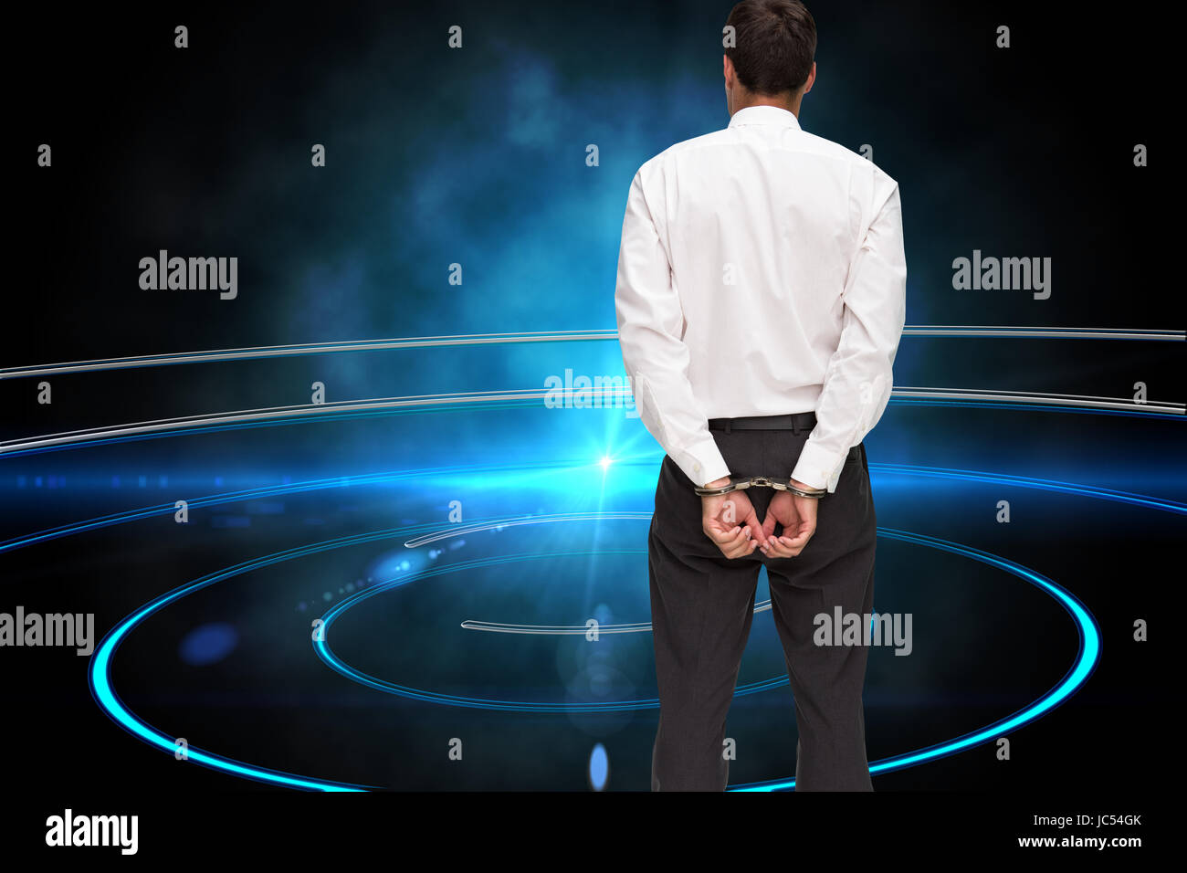 Composite image of young businessman wearing handcuffs Banque D'Images