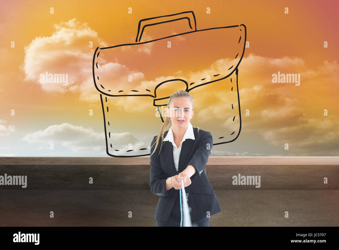 Image composite de blond businesswoman pulling a rope Banque D'Images