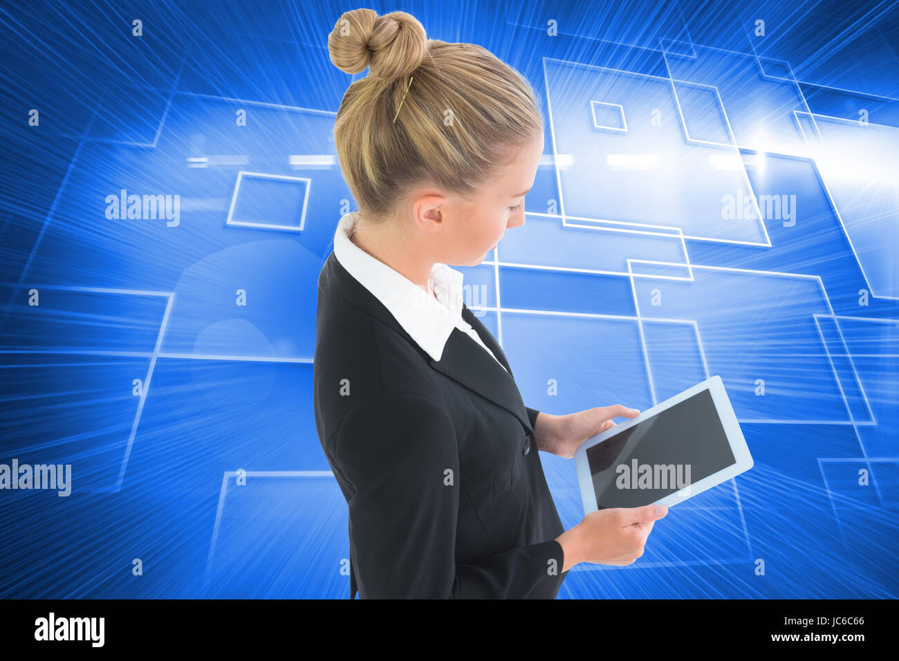 Image composite de blond businesswoman holding tablet Banque D'Images