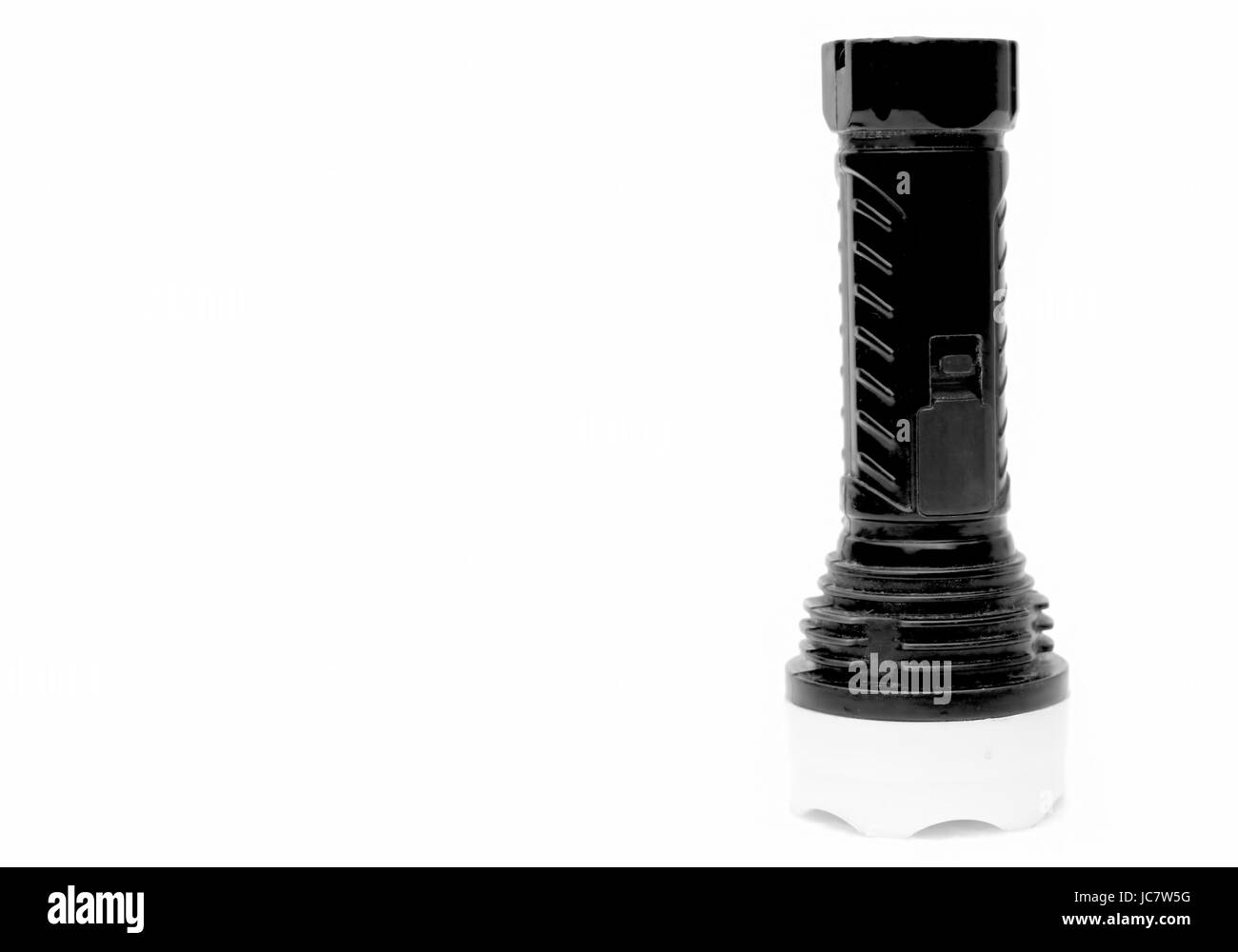 Les enfants jouet batterie torche, isolé sur blanc. Moins est plus. Banque D'Images