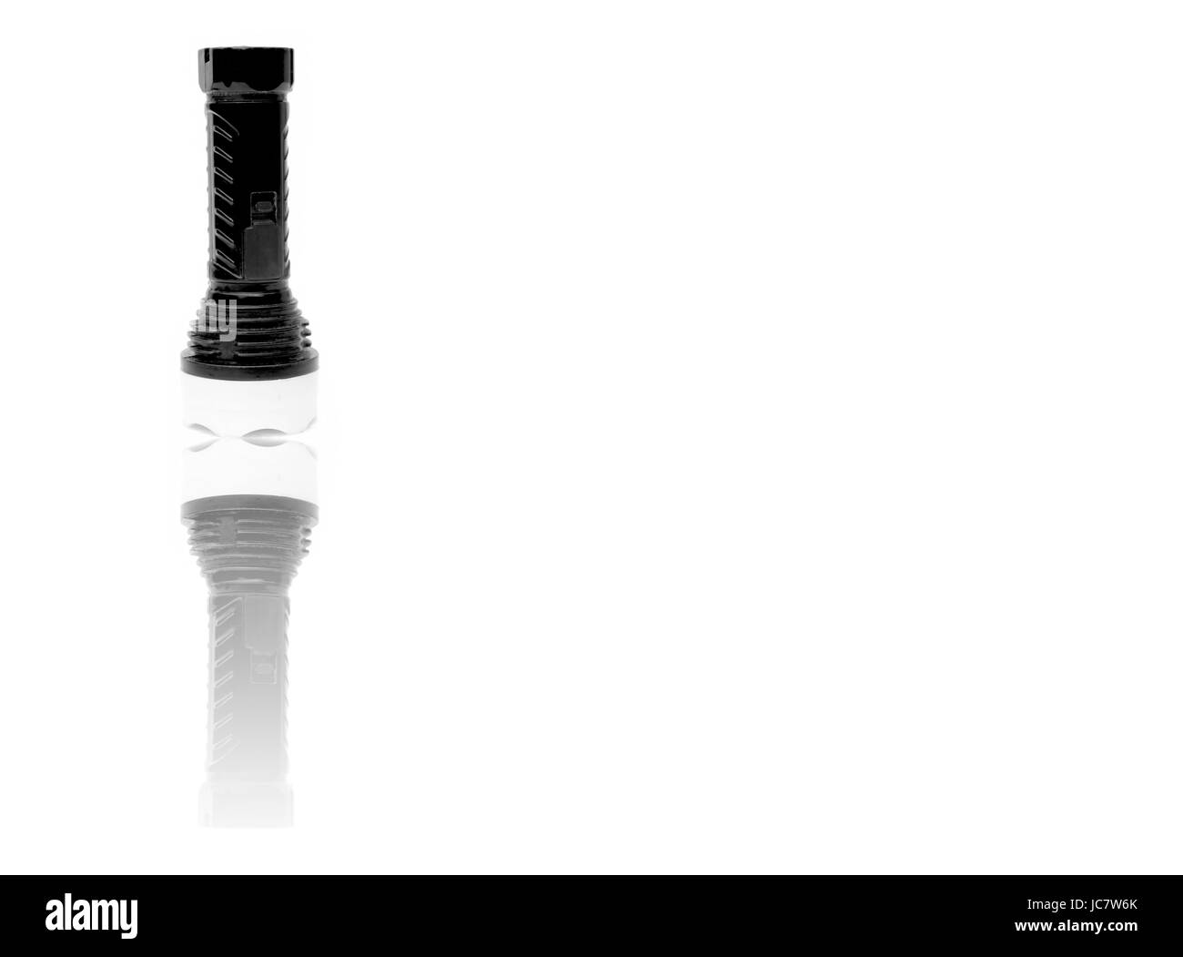 Les enfants jouet batterie torche, isolé sur blanc. Moins est plus. Banque D'Images