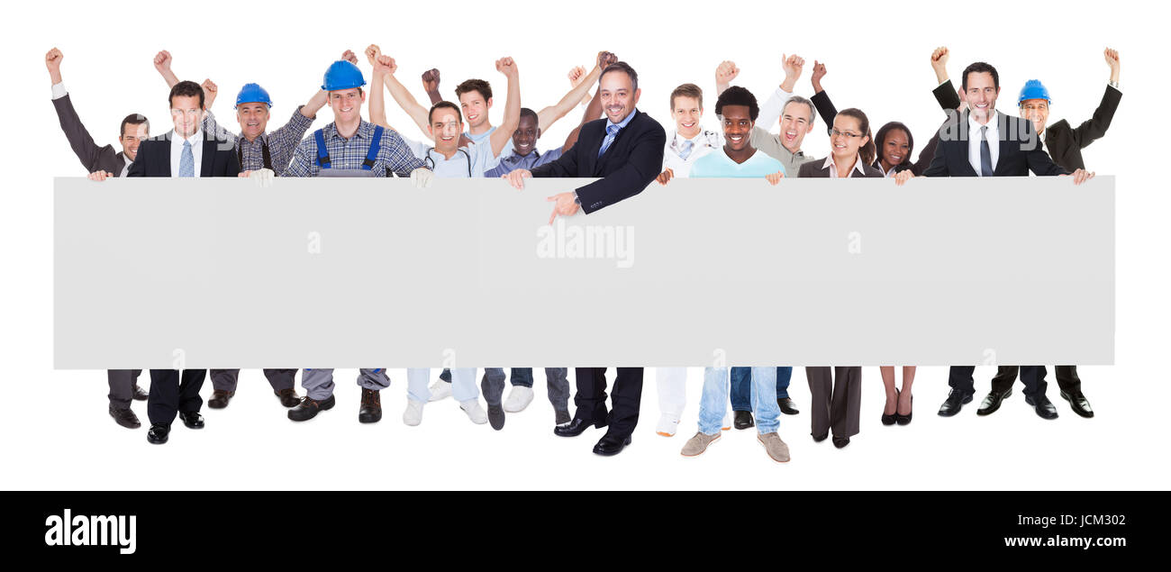 Full Length portrait of smiling people avec diverses professions holding blank billboard sur fond blanc Banque D'Images