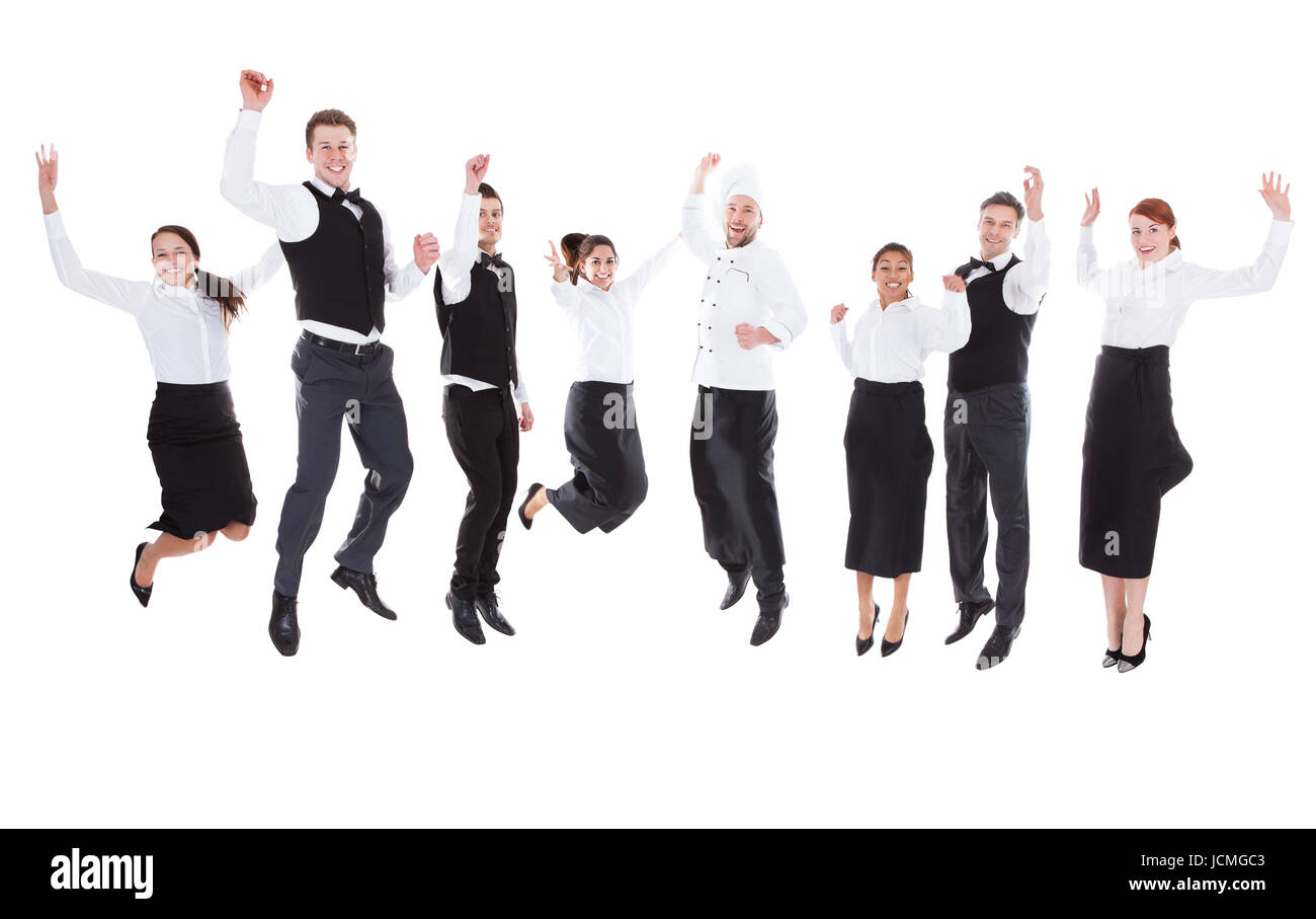 Les serveurs et serveuses jumping over white background Banque D'Images