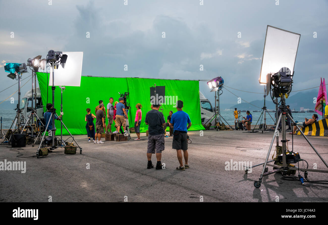 Film Asiatique d'être filmé devant un écran vert, Hong Kong, Chine. Banque D'Images