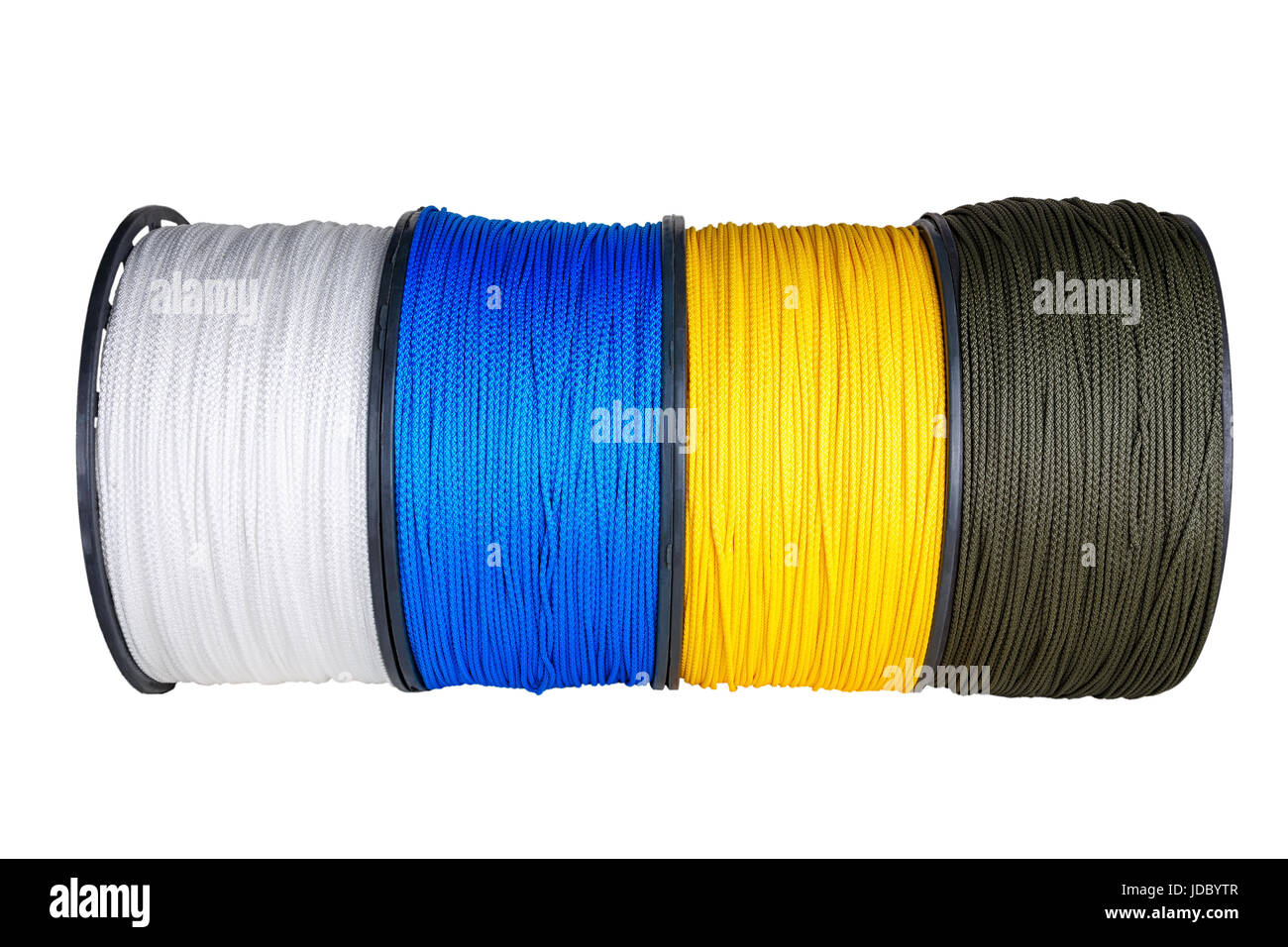 Quatre bobines de câbles en matière synthétique de différentes couleurs les unes à côté des autres commandes Banque D'Images