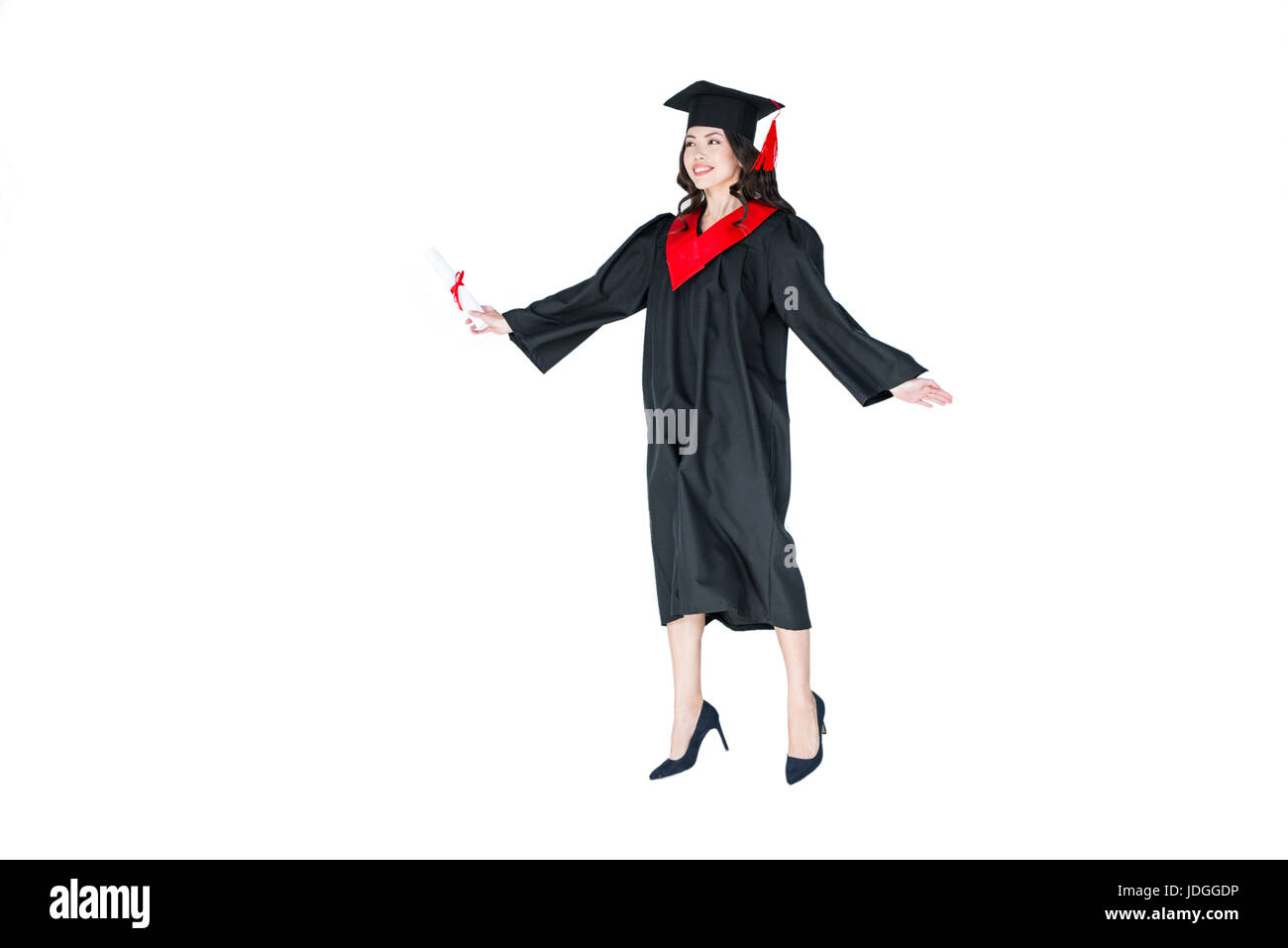 En étudiant attrayant graduation cap avec diplôme jumping isolated on white Banque D'Images
