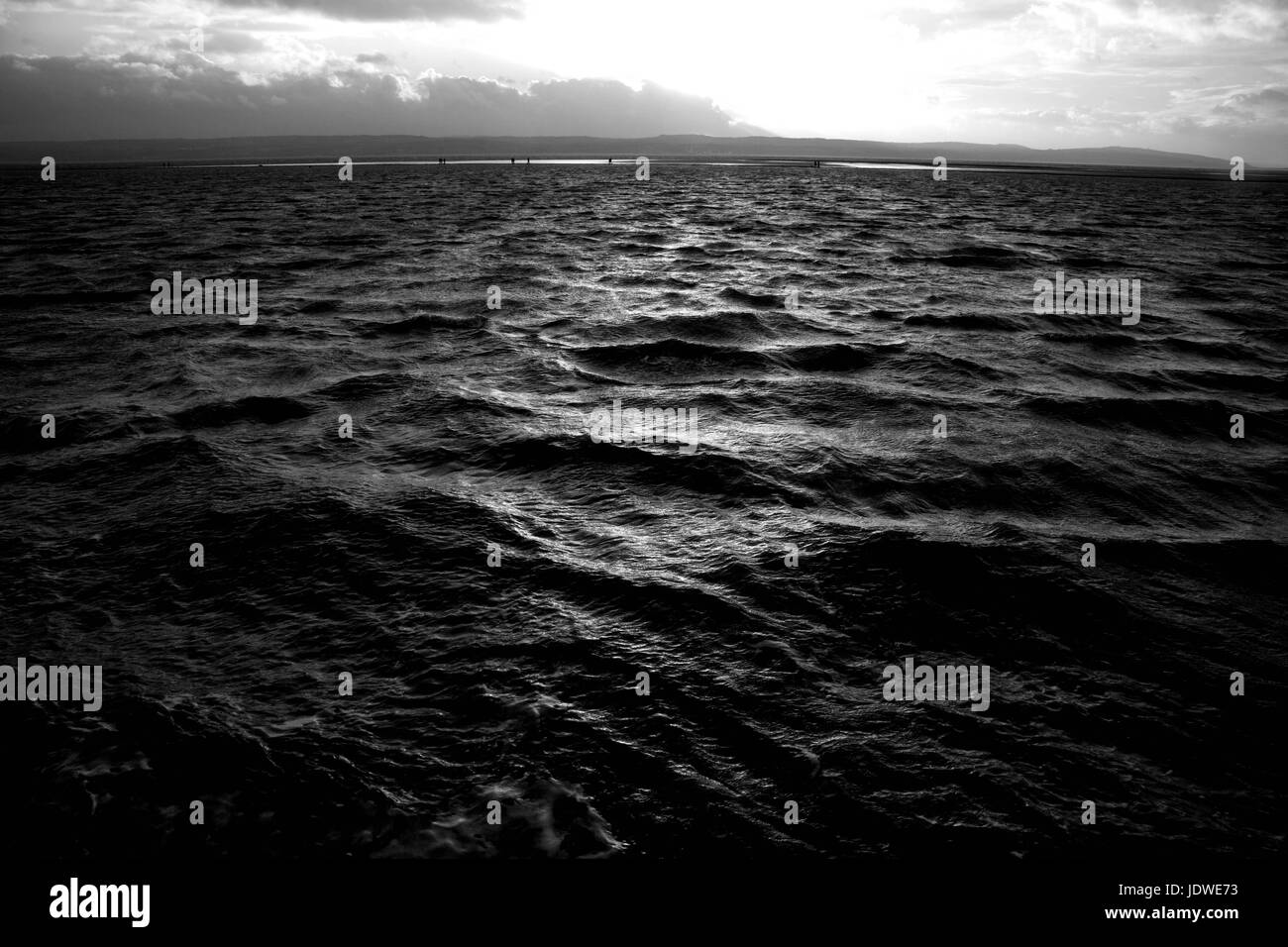 Le lac marin West Kirby sur le Wirral pendant le coucher de soleil orageux Banque D'Images
