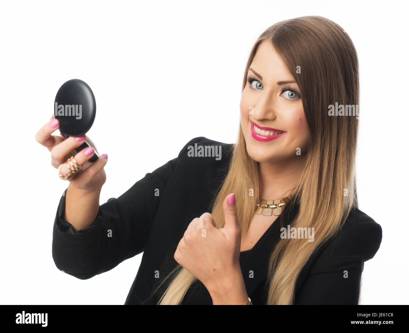 Femme tenant un miroir à main Banque D'Images