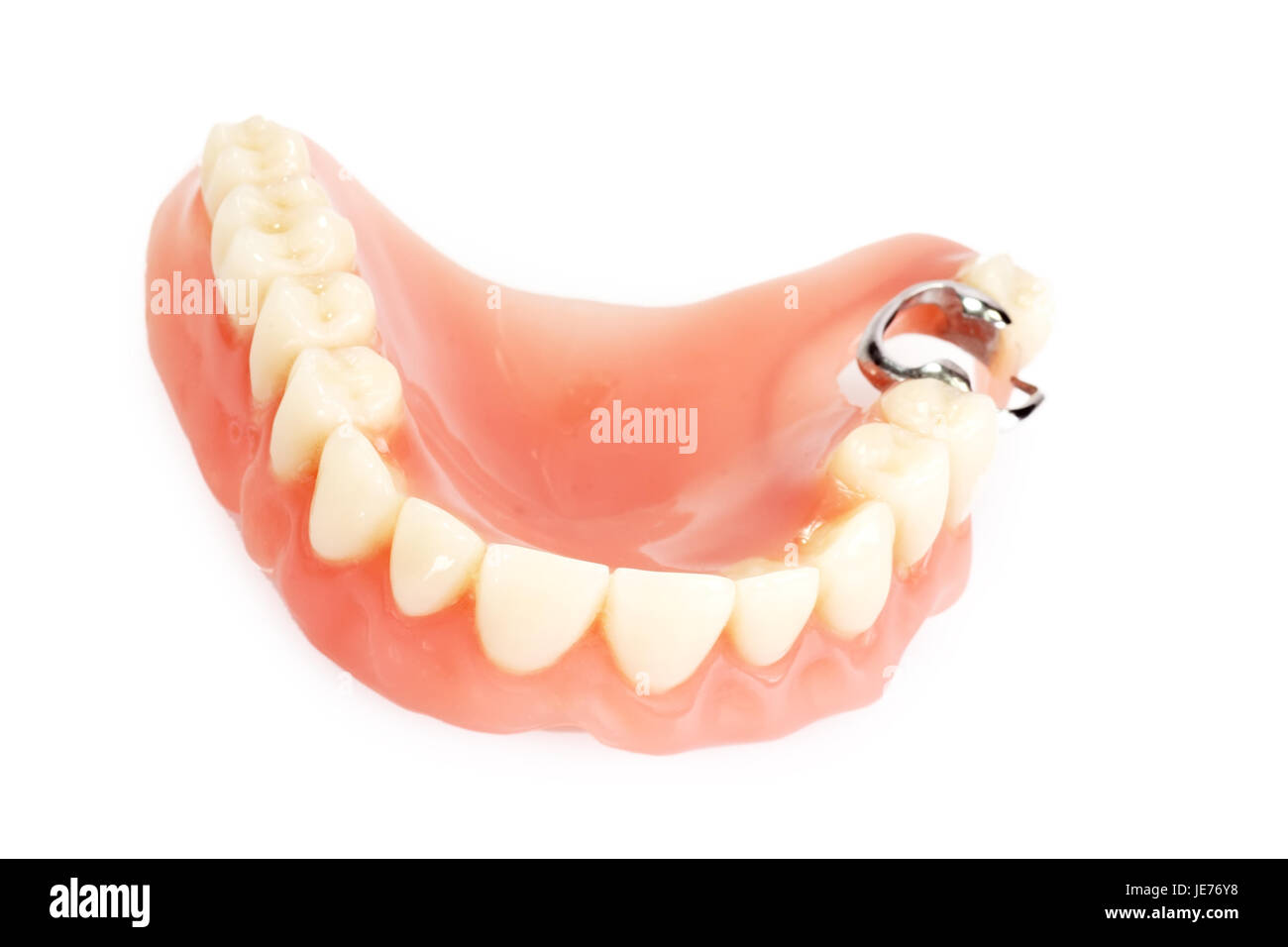 Prothèse dentaire sur fond lumineux Banque D'Images