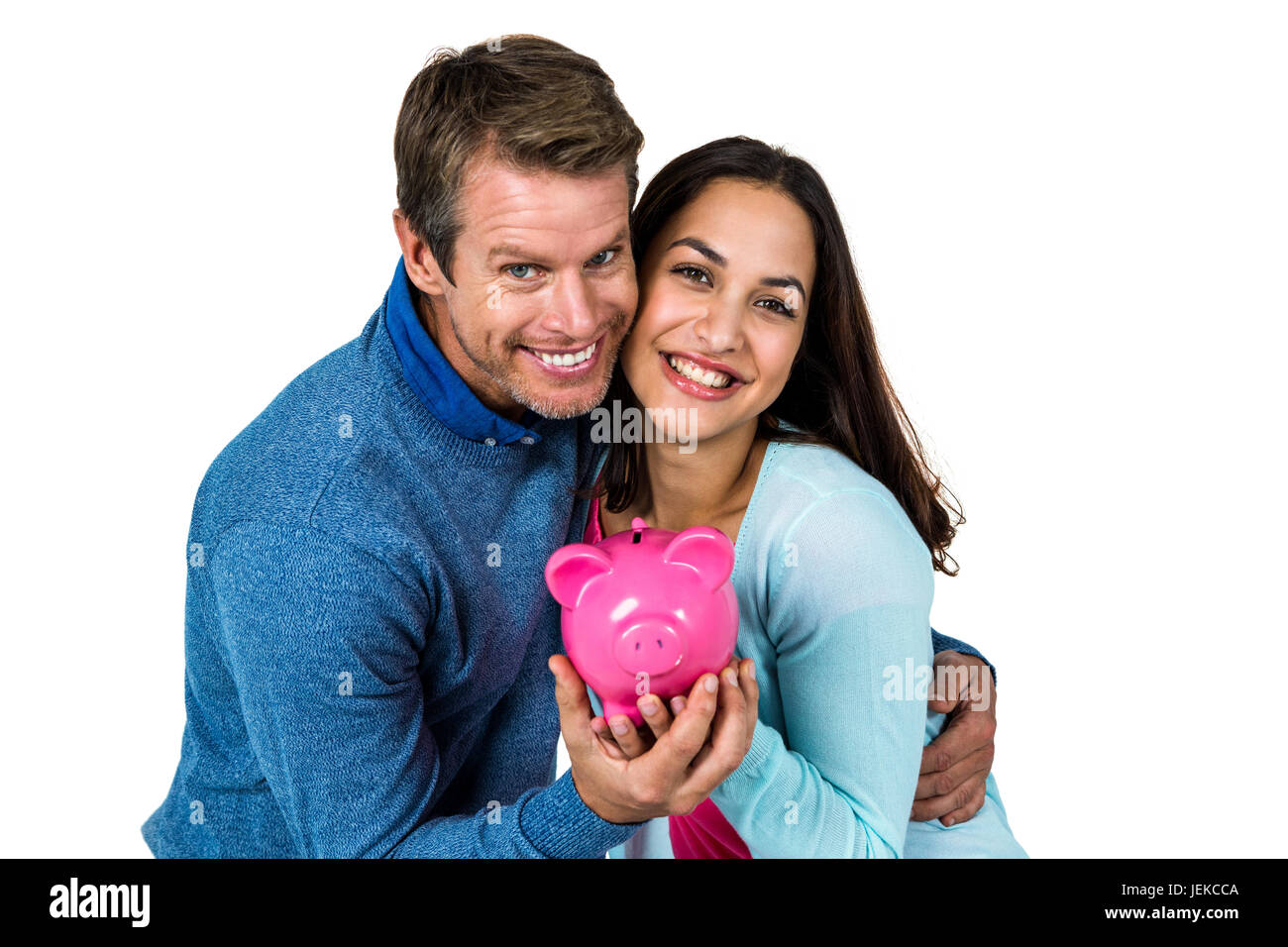 Smiling couple avec pink piggy bank Banque D'Images