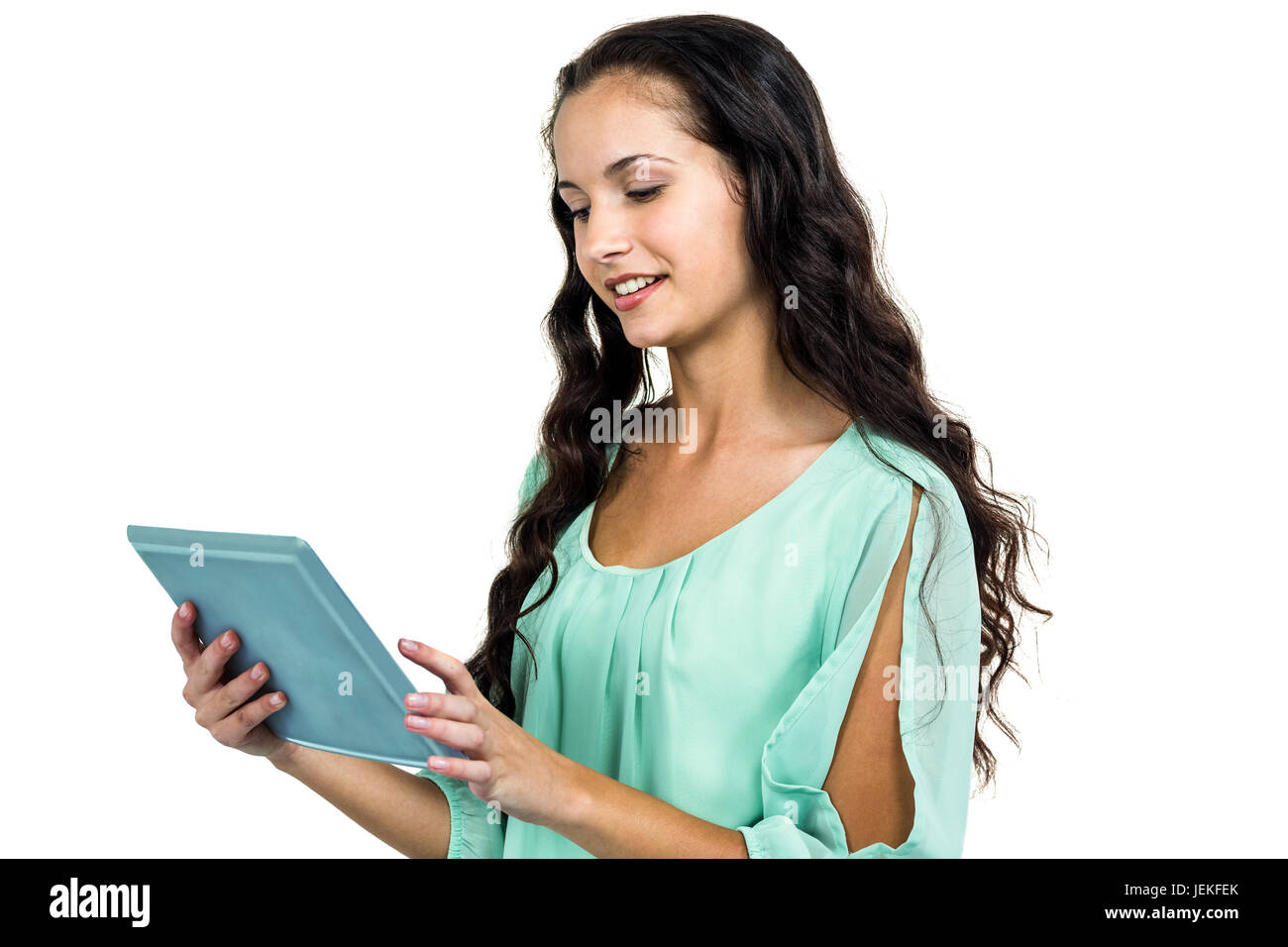 Smiling woman using tablet Banque D'Images