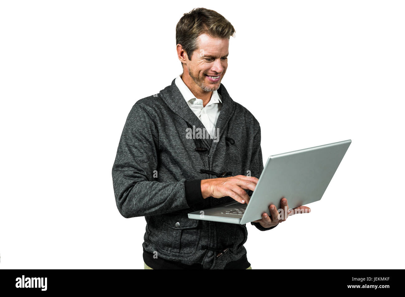 Cheerful man using laptop Banque D'Images