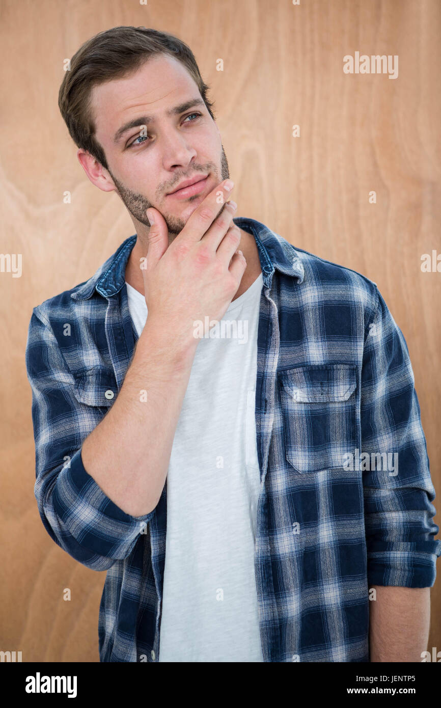 Beau hipster with hand on chin Banque D'Images