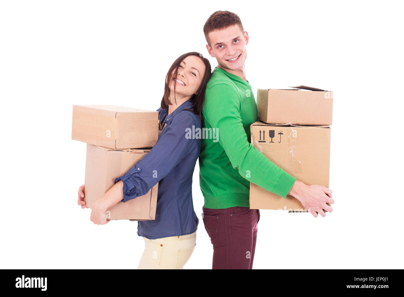 Happy smiling man and woman carrying boxes isolé sur fond blanc. Couple a ordre d'achats Banque D'Images