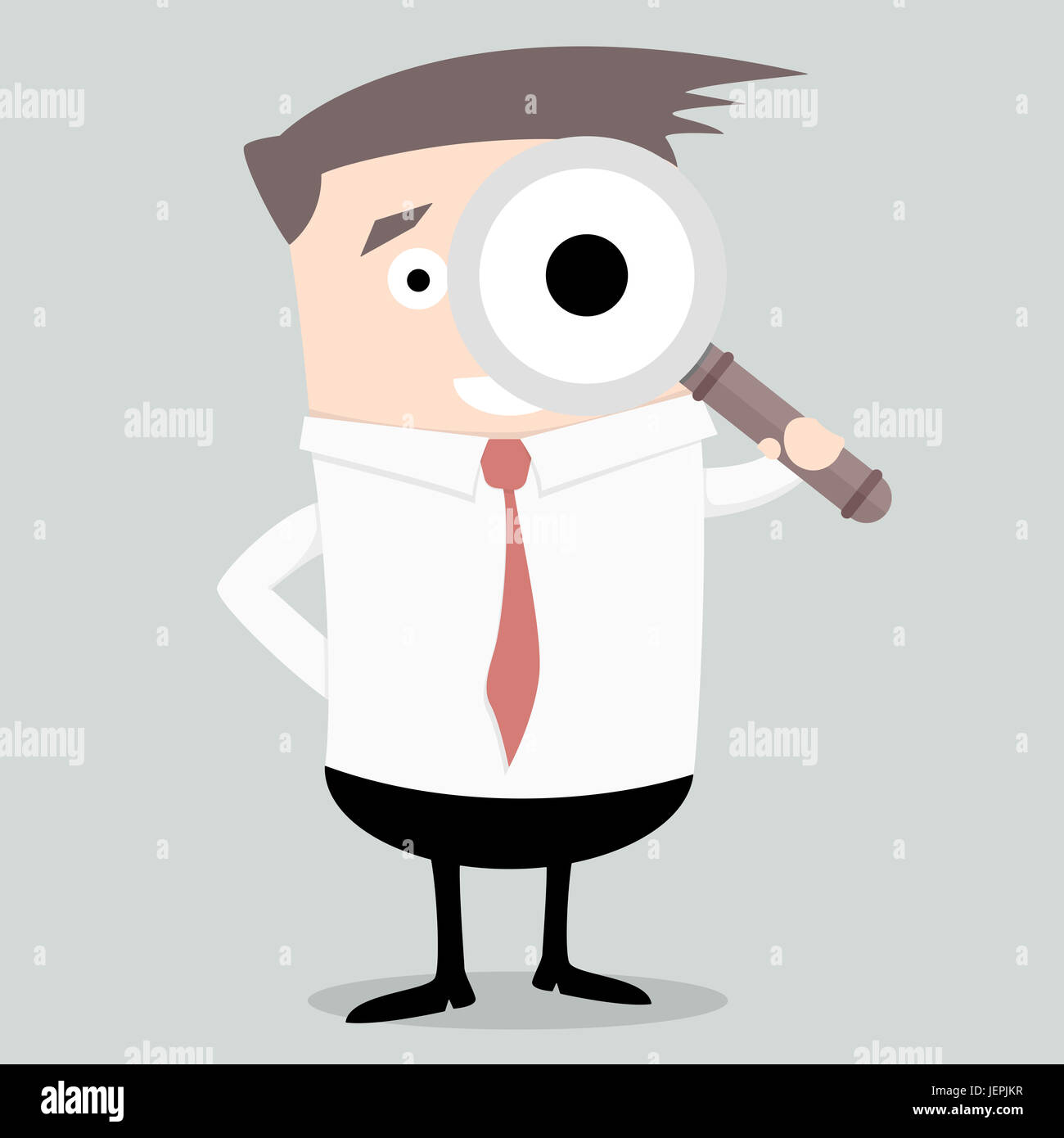 Businessman with magnifying glass Banque D'Images