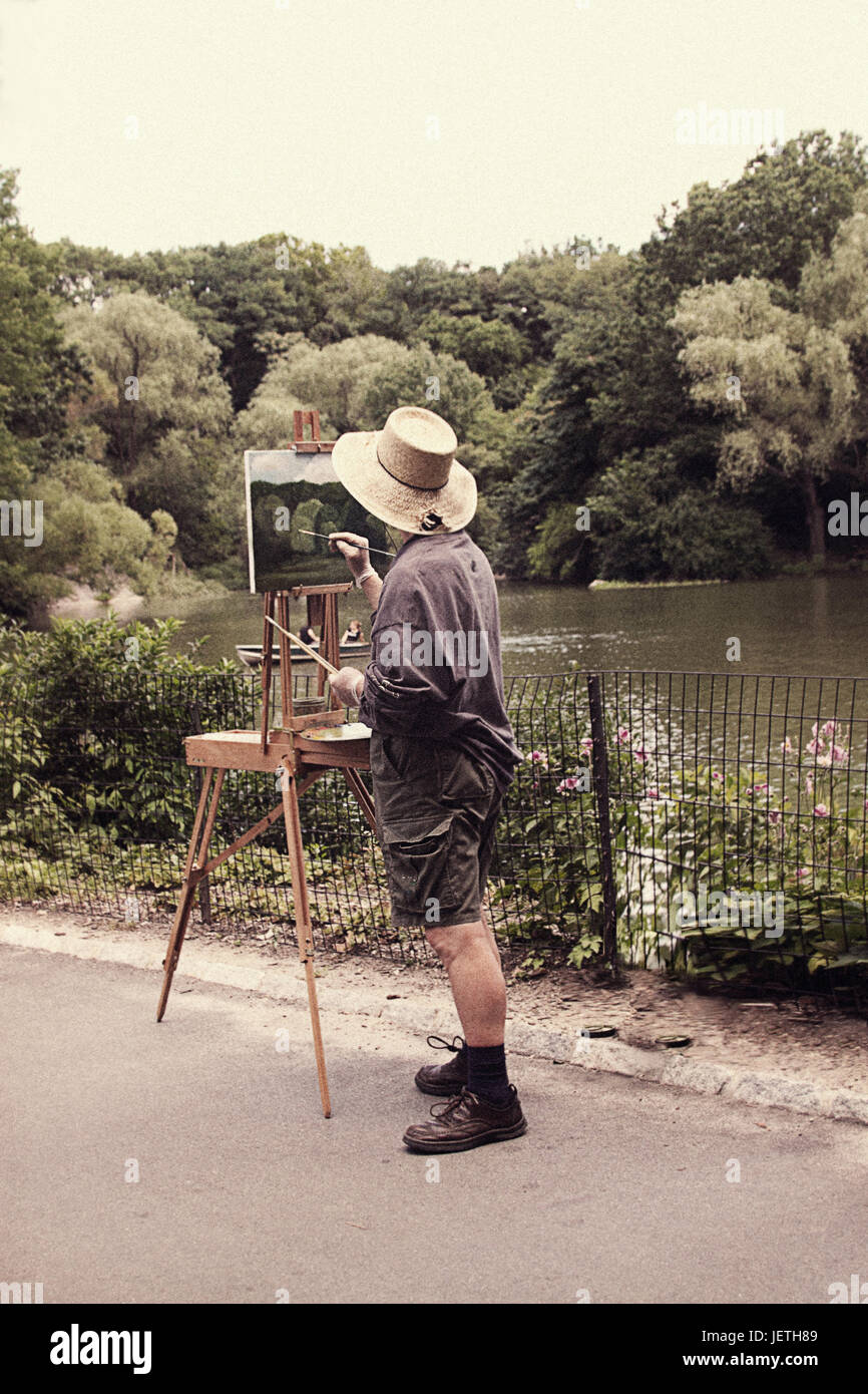 Un homme peindre un paysage à Central Park Banque D'Images