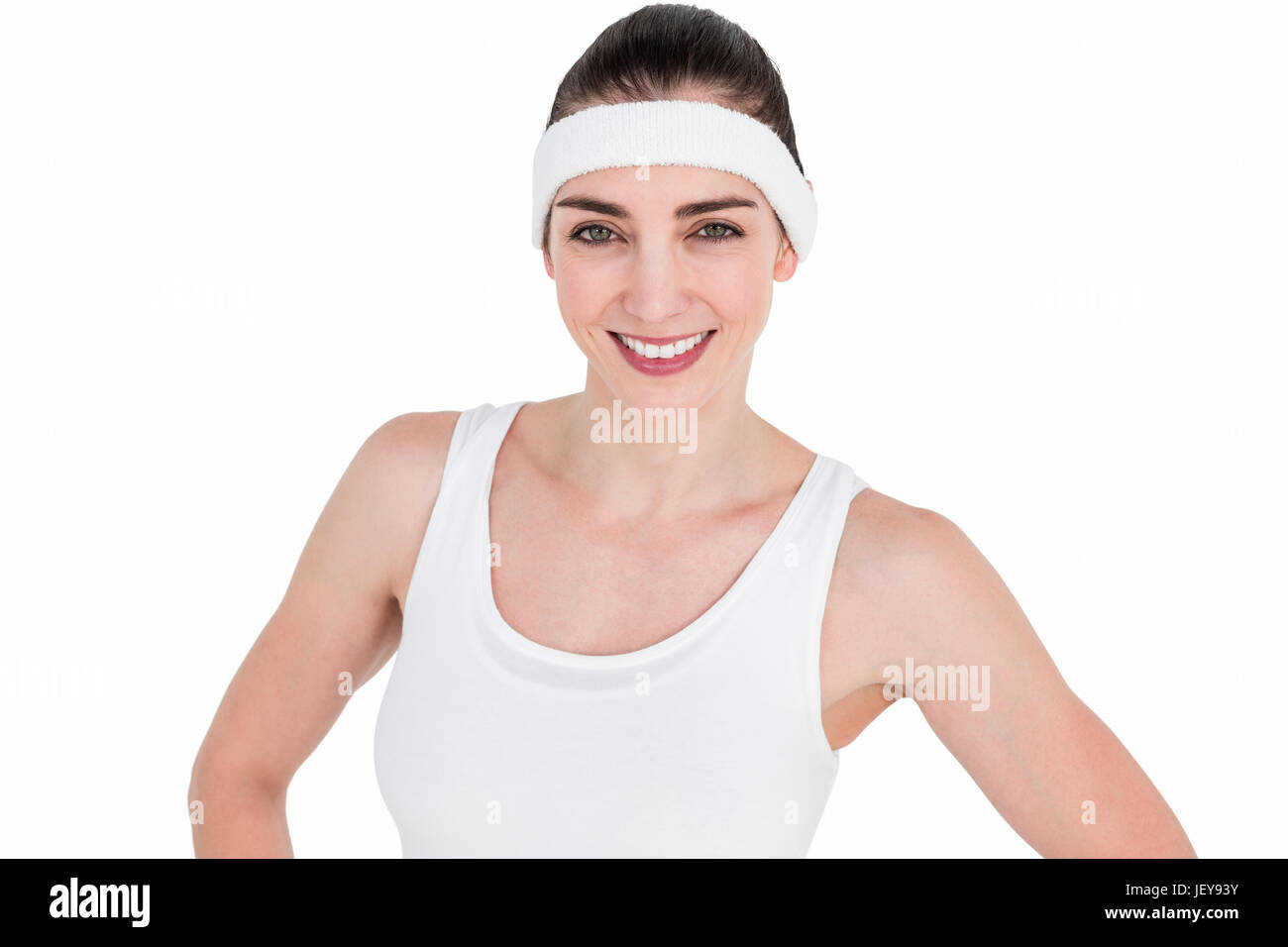 Athlète féminin posant avec mains sur la hanche Banque D'Images