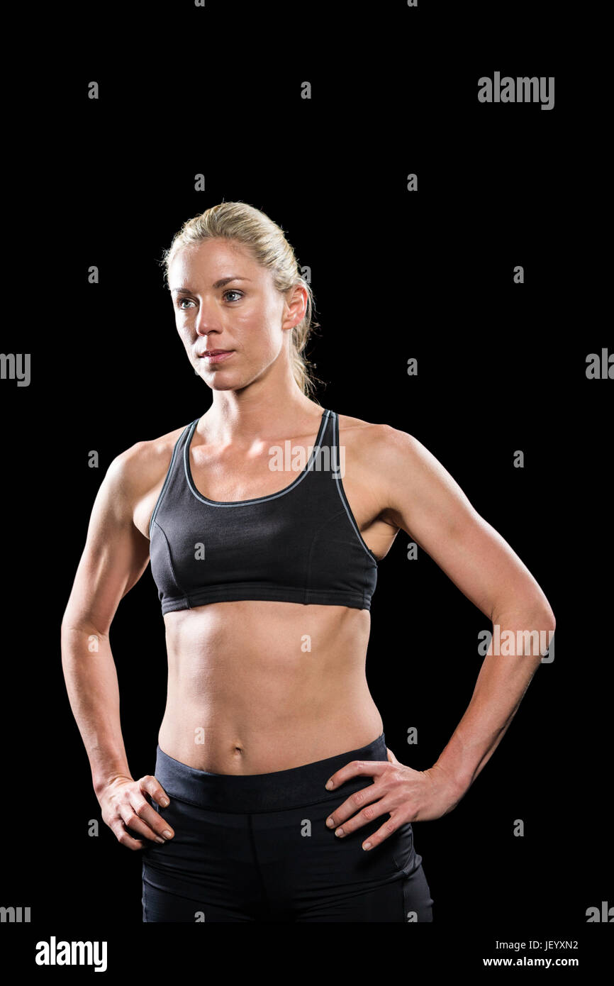 Comité permanent de l'athlète féminine with hand on hip Banque D'Images