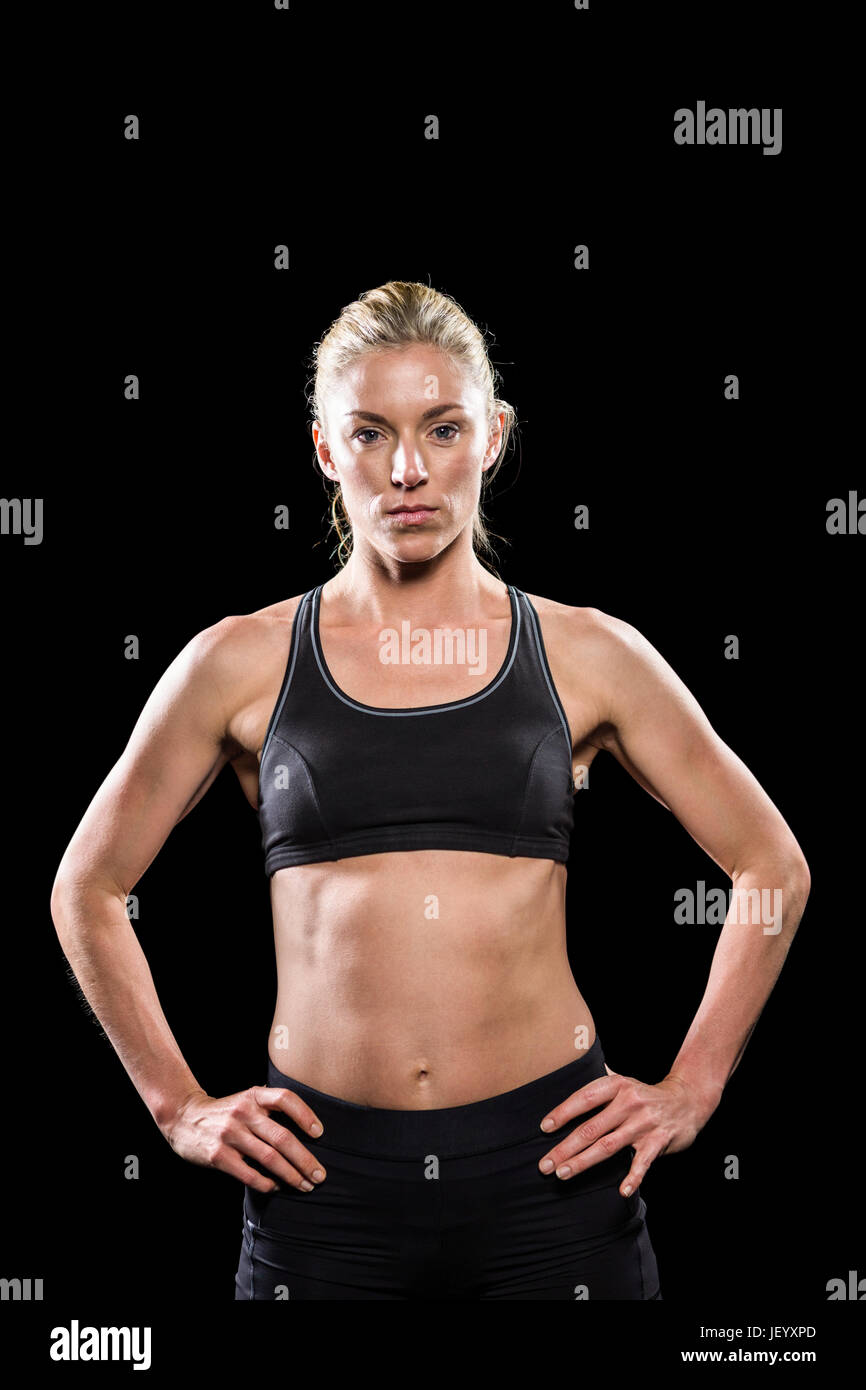 Comité permanent de l'athlète féminine with hand on hip Banque D'Images