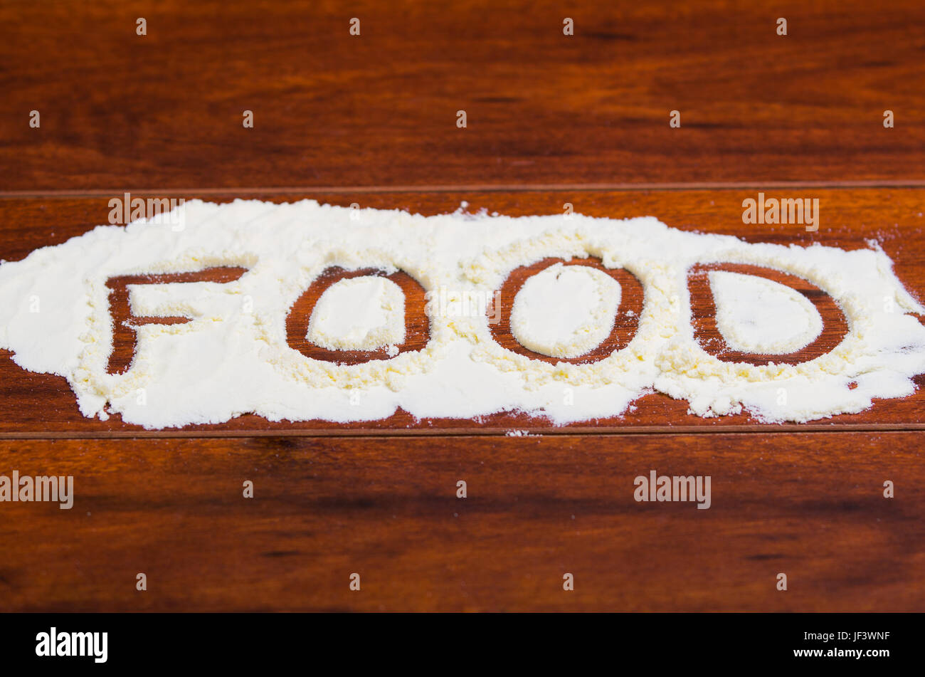 Le mot écrit en alimentaire poudre stevia sur fond de bois. Banque D'Images