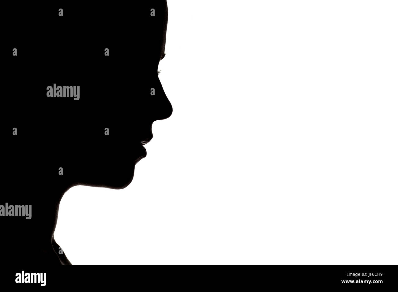 Silhouette de profil d'une femme sur fond blanc Banque D'Images