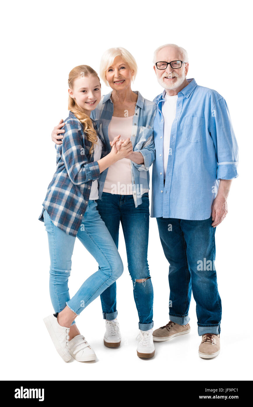 Grand-père, la grand-mère et petite-fille huging ensemble isolated on white Banque D'Images