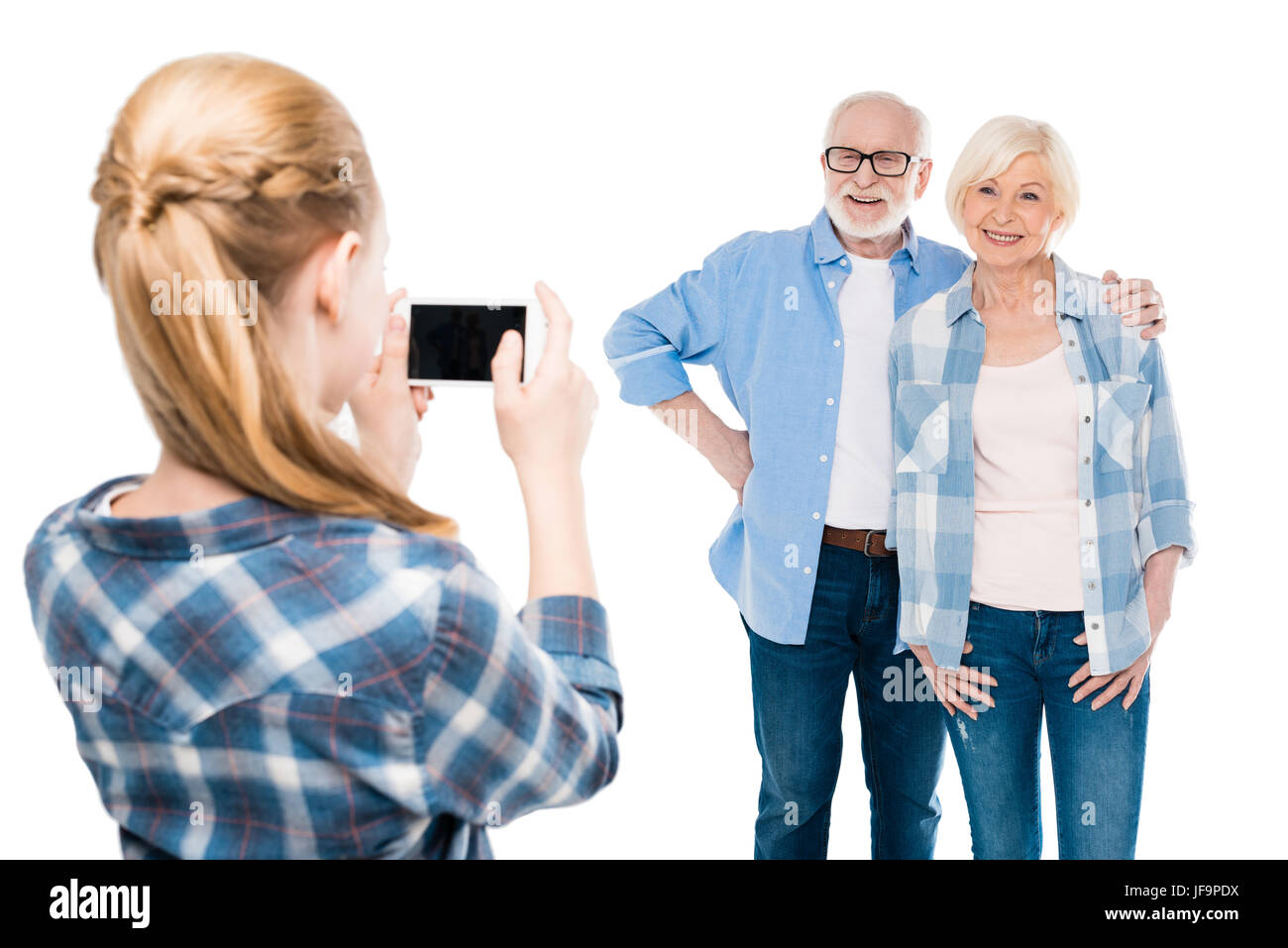 Petit-fils de prendre photo de grand-mère et grand-père isolated on white Banque D'Images