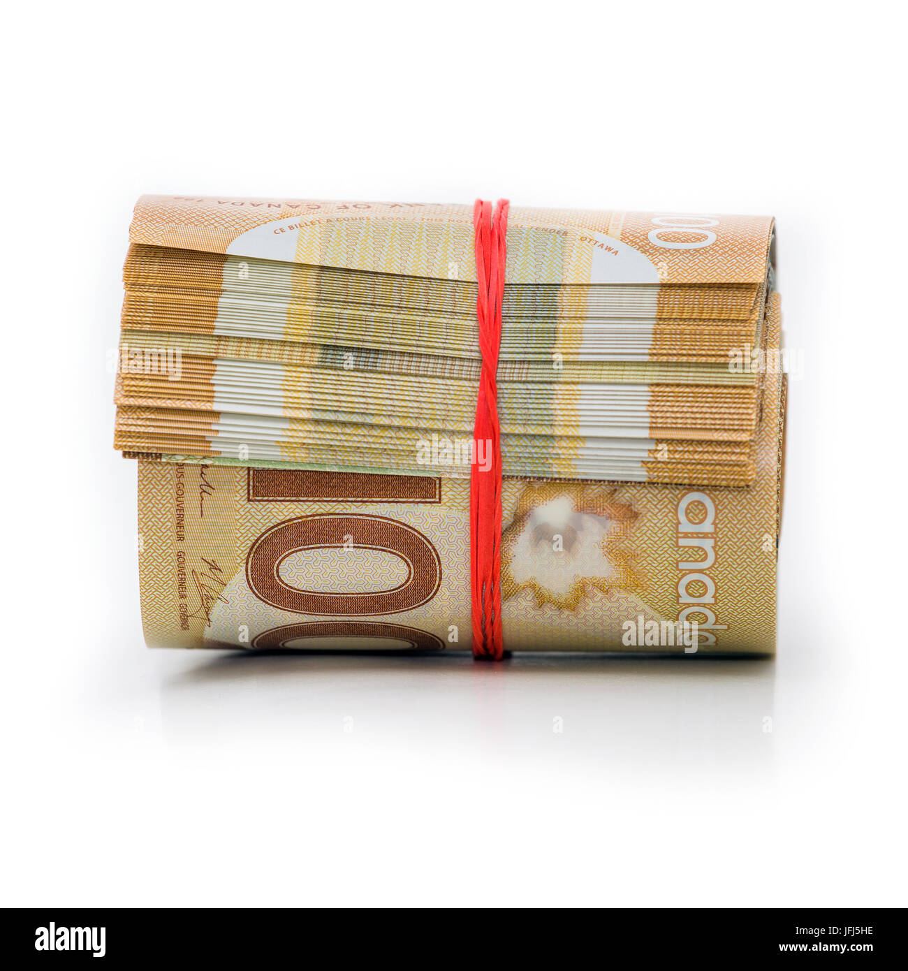 Rouleau de billets de banque canadiens wraped avec une bande de caoutchouc Banque D'Images