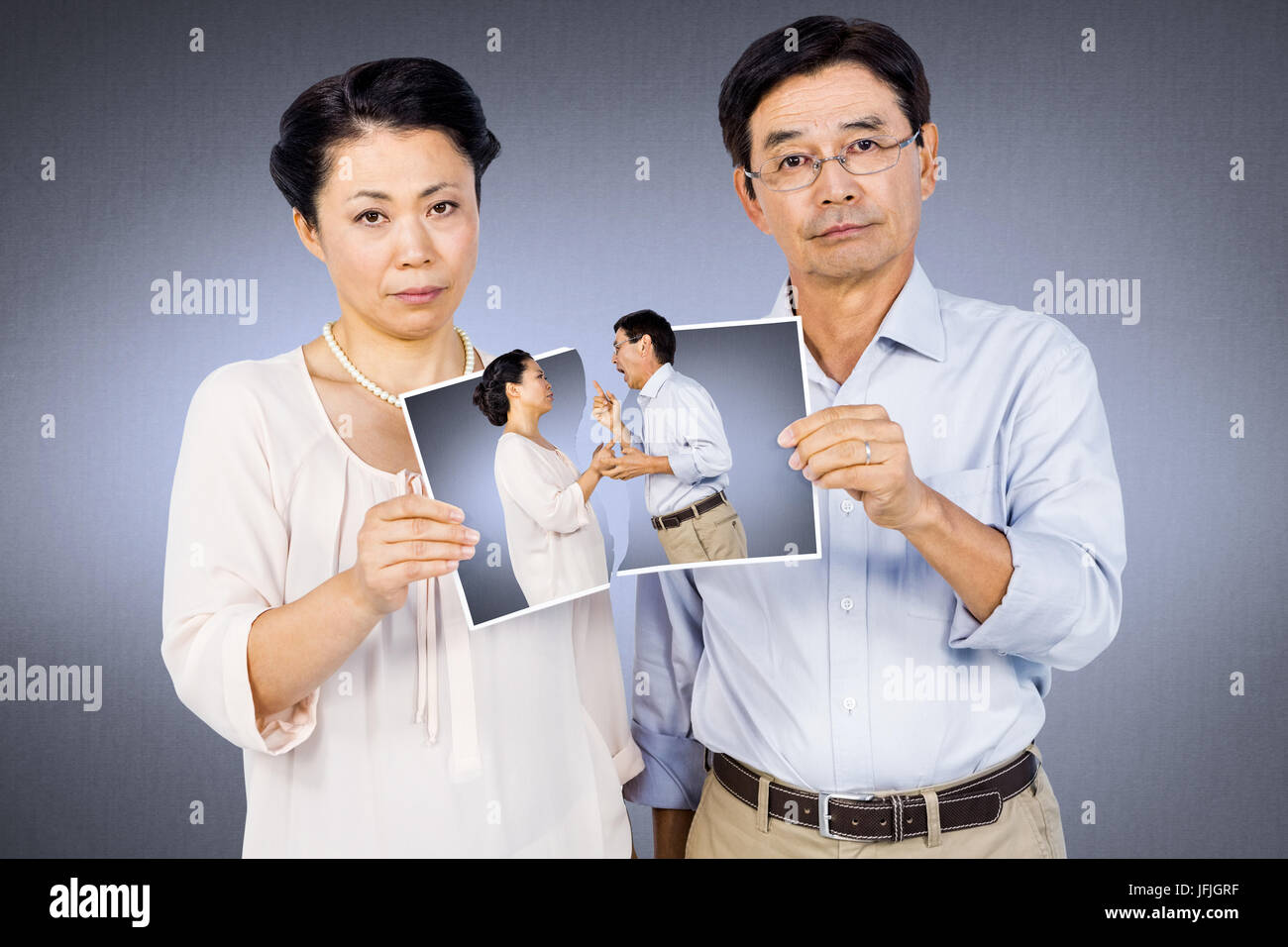 Composite image of asian woman holding a photo Banque D'Images