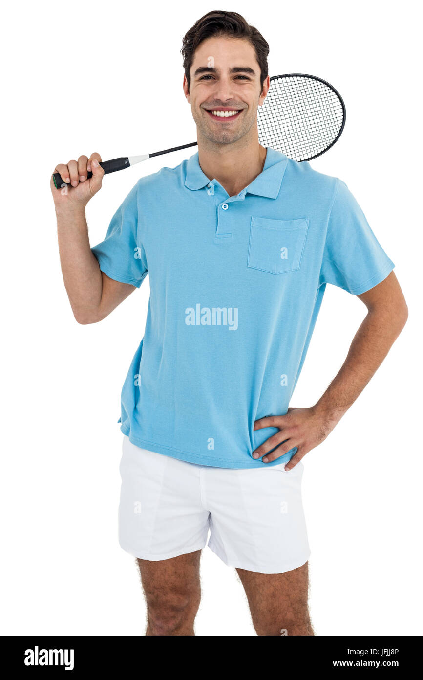 Joueur de badminton debout sur fond blanc with hand on hip Banque D'Images