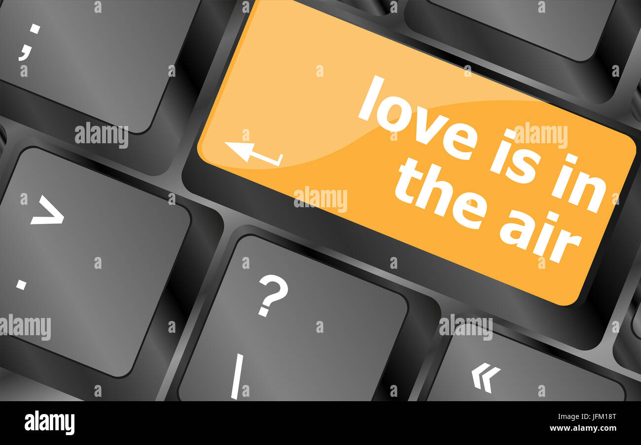 Clavier moderne avec l'amour est dans le texte de l'air Banque D'Images Clavier moderne avec l'amour est dans le texte de l'air Banque D'Images