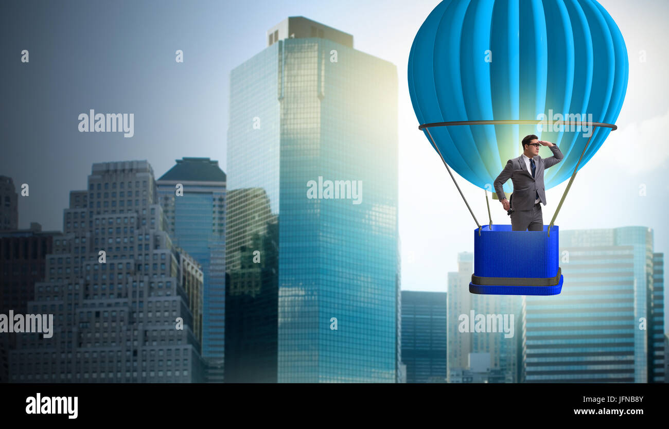 Businessman flying sur ballon en concept défi Banque D'Images