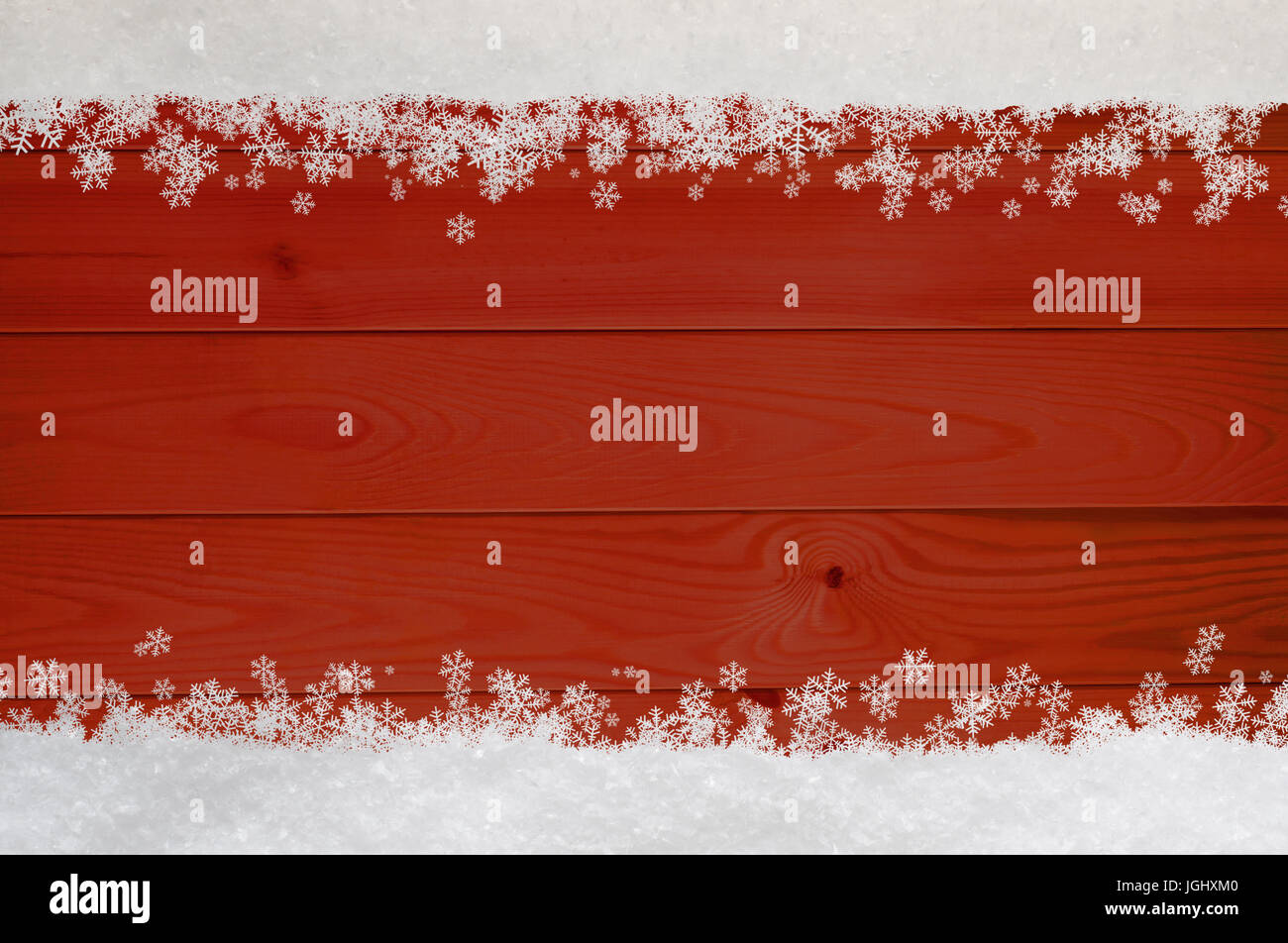 Neige de Noël et flocons de frontière à haut et bas du bordé en bois rouge. Banque D'Images