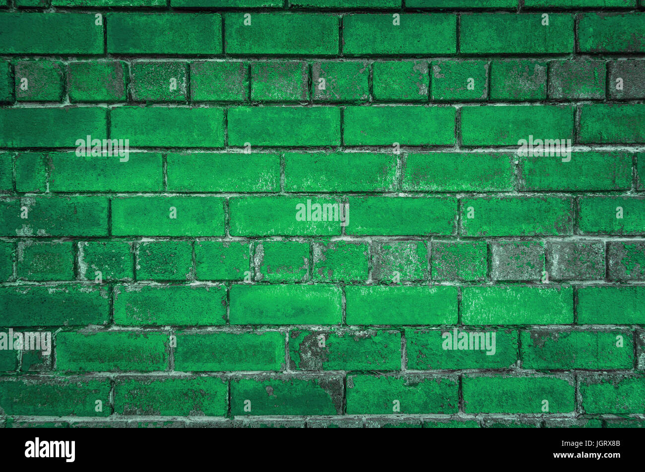 Le fond vert de la vieille brique. Mur peint en vert en grunge style ou style loft. Banque D'Images