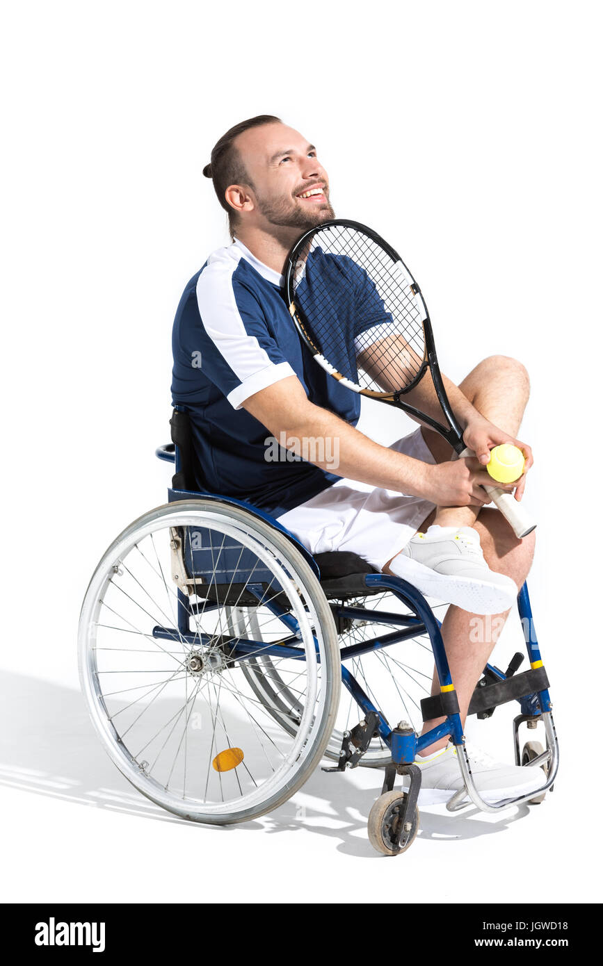 Les jeunes personnes handicapées en fauteuil roulant tennis player sitting and smiling isolated on white Banque D'Images
