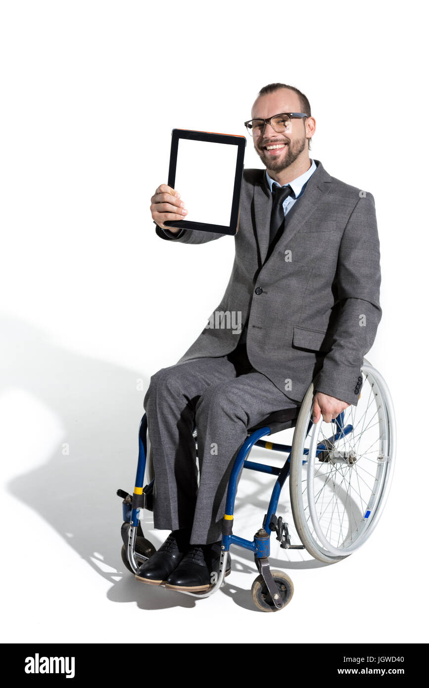 Les jeunes handicapés en fauteuil roulant d'affaires with digital tablet Banque D'Images