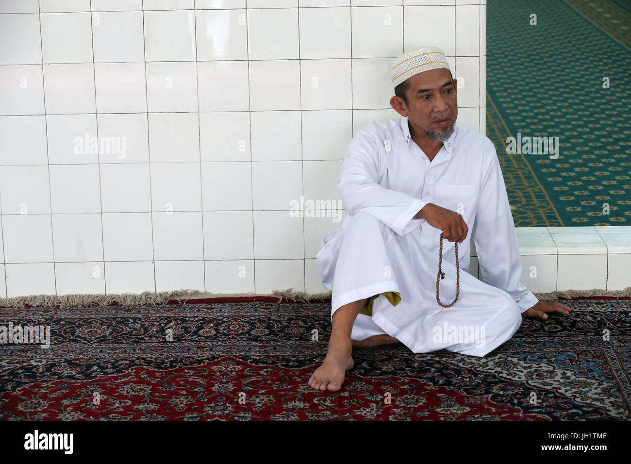 Mosquée musulman (la mosquée centrale de Saigon). La prière musulmane avec tasbih (chapelet), Ho Chi Minh Ville. Le Vietnam. Banque D'Images
