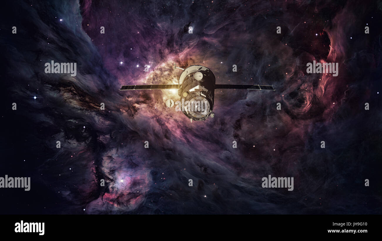 Les progrès de l'engin spatial en orbite autour de la nébuleuse de l'espace. Éléments de cette image fournie par la NASA. Banque D'Images