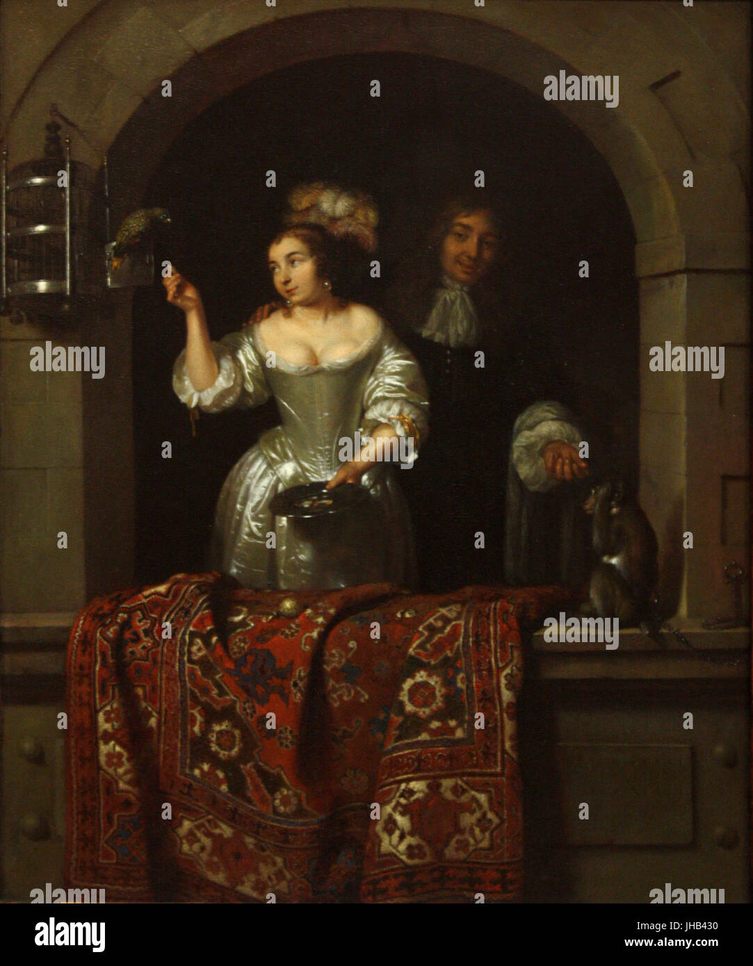 Caspar Van - une dame avec un perroquet et un homme avec un singe (1664) Banque D'Images