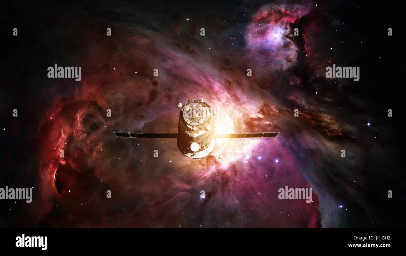 Les progrès de l'engin spatial en orbite autour de la nébuleuse de l'espace. Éléments de cette image fournie par la NASA. Banque D'Images