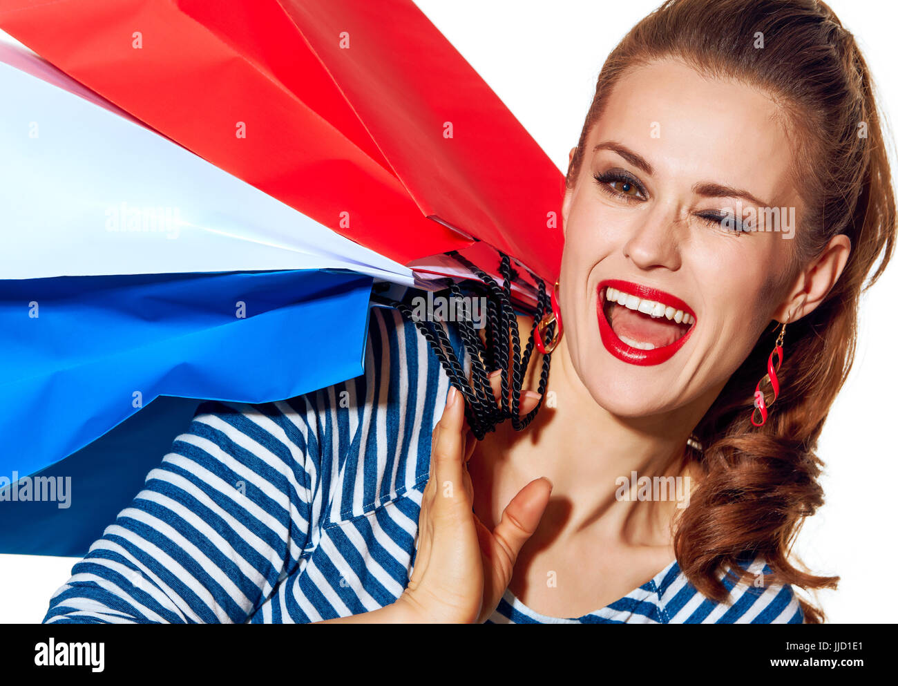 Le Shopping. L'approche française. Portrait of happy fashion élégant-monger shopping des couleurs du drapeau français isolé sur fond blanc w Banque D'Images