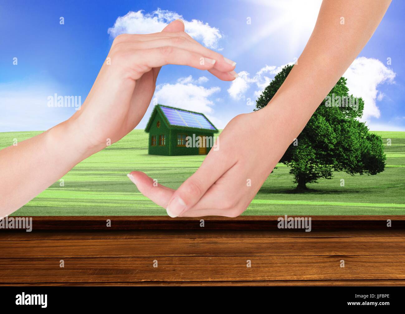 Digital composite of grass house avec panneaux entre les mains dans le domaine Banque D'Images