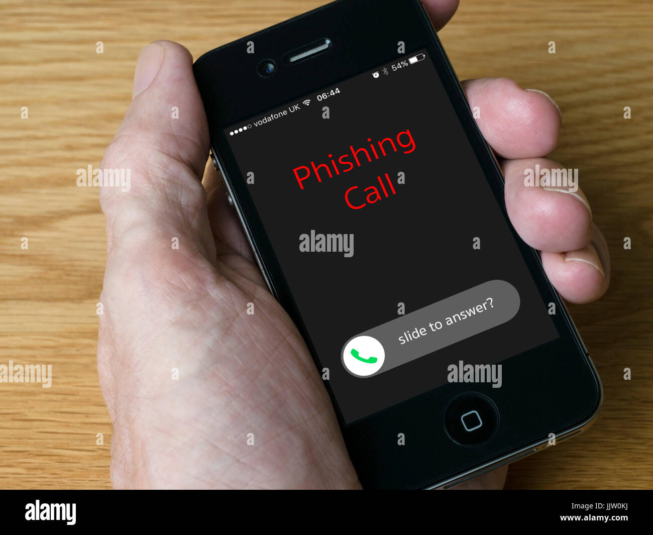 Notion de droit - Appel entrant le Phishing sur iPhone téléphone mobile de poche afficher Banque D'Images