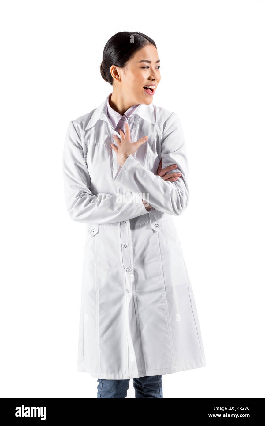 Asian female doctor standing in white coat isolated on white Banque D'Images