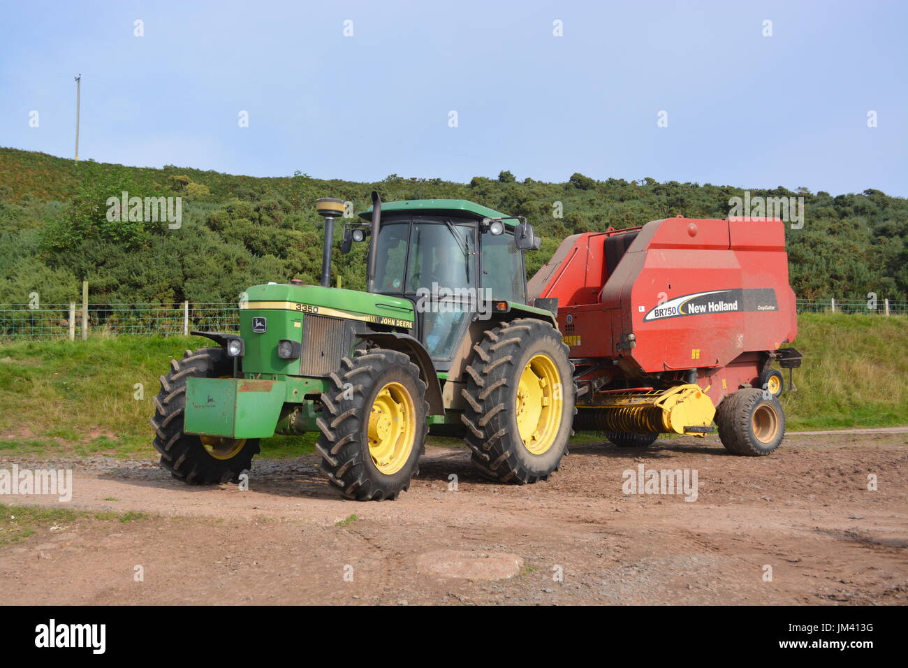 3350 John Deere 1992 avec presse New Holland Banque D'Images
