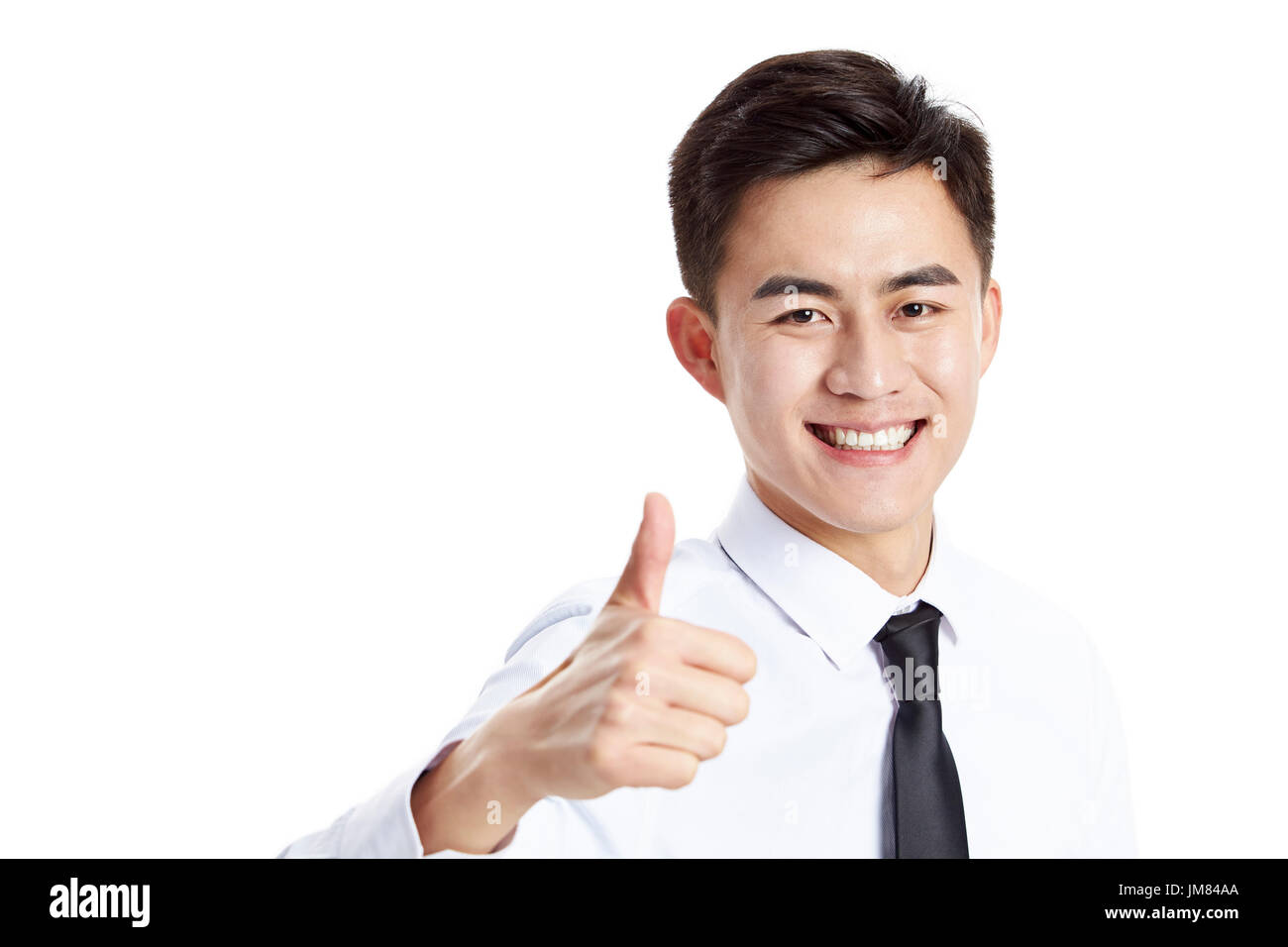 Young Asian businessman showing thumb-up Connexion, heureux et souriants, studio shot, isolé sur fond blanc. Banque D'Images