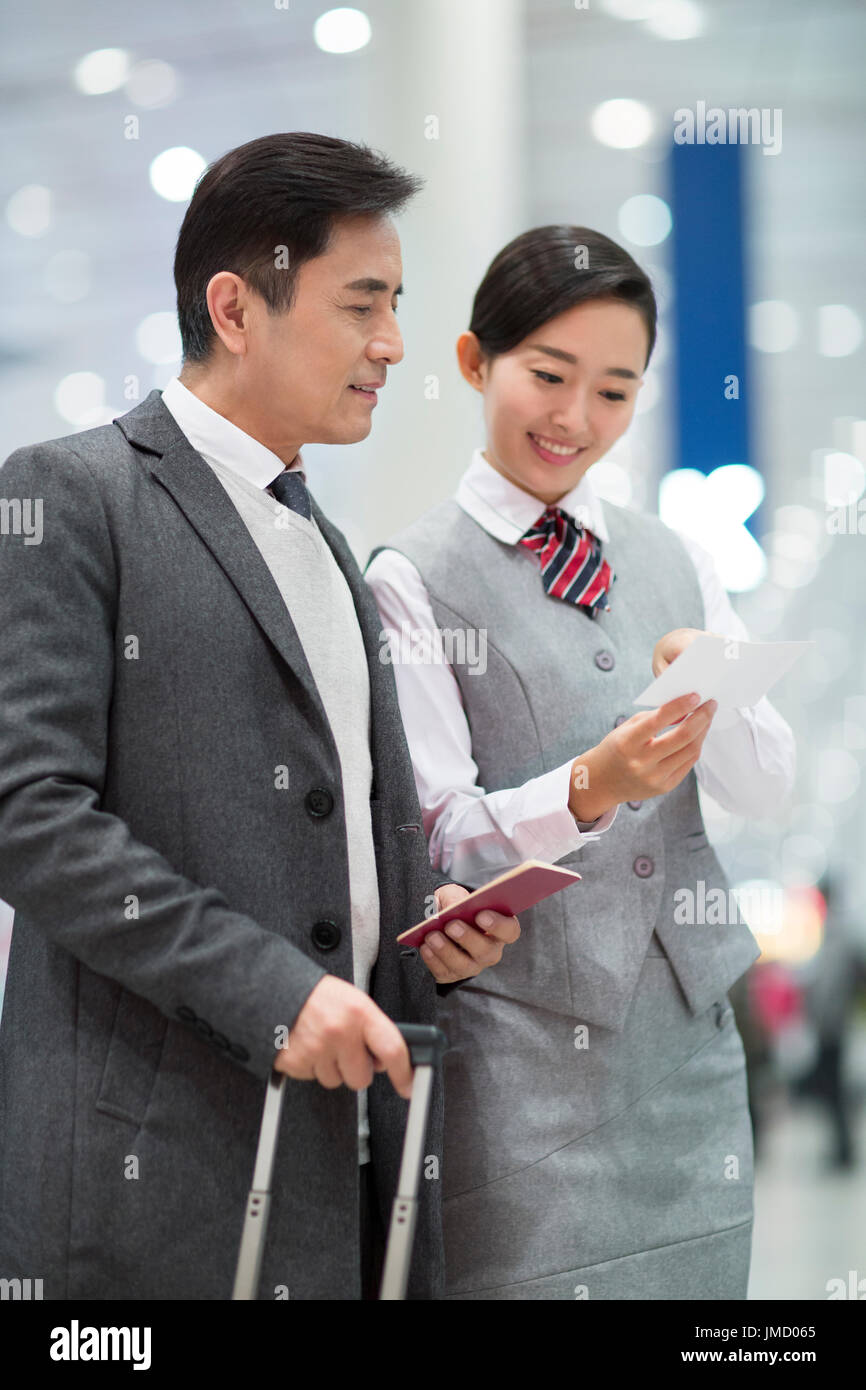 Hôtesse de Chinese et passager Banque D'Images