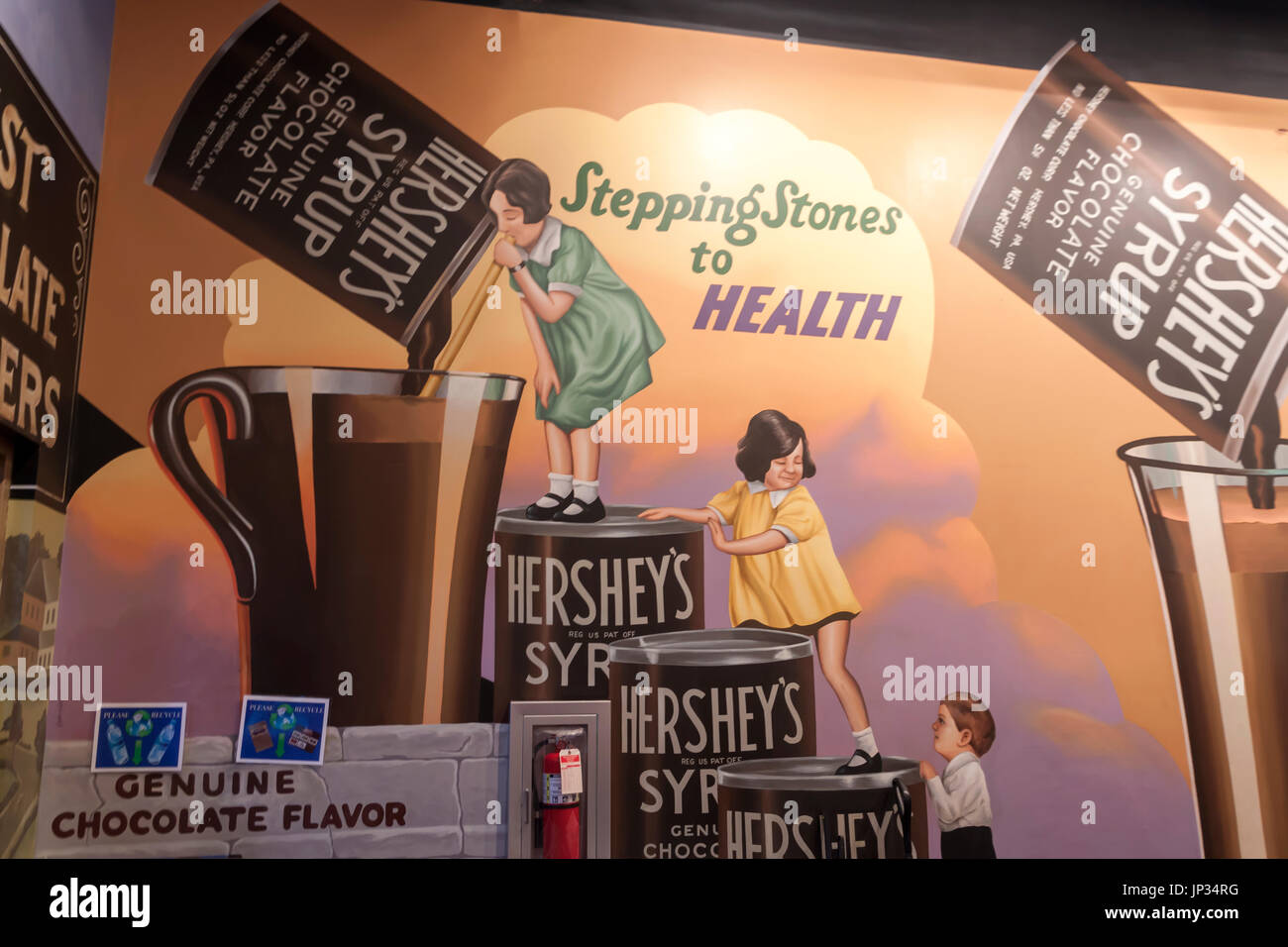 Peinture des années 30 Hershey's annonce disant le chocolat est bon pour la santé et le bien-être.Les enfants sont des boîtes d'escalade pour atteindre un verre de lait au chocolat. Banque D'Images