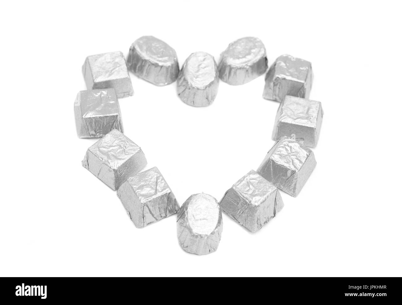 Bonbons de chocolat en d'aluminium formant la forme de coeur Banque D'Images